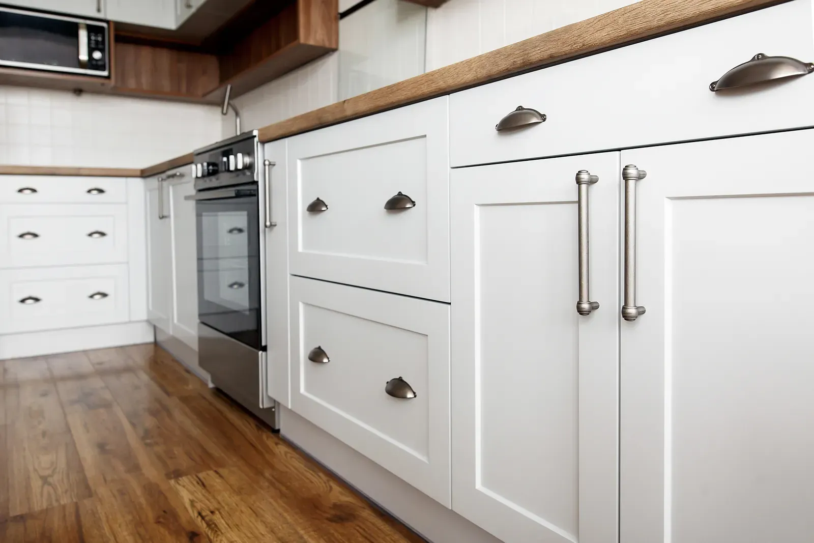 A kitchen with unprocessed cabinet refacing material. | WP Kitchen Remodeling